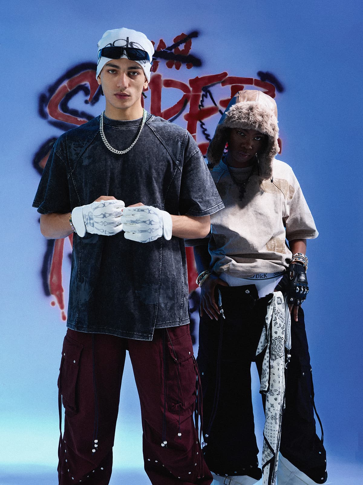 Oversized washed T-shirts with broad shoulders and wide sleeves styled with loose cargo pants