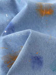 Jeansshorts mit Farbspritzermuster und weitem Bein