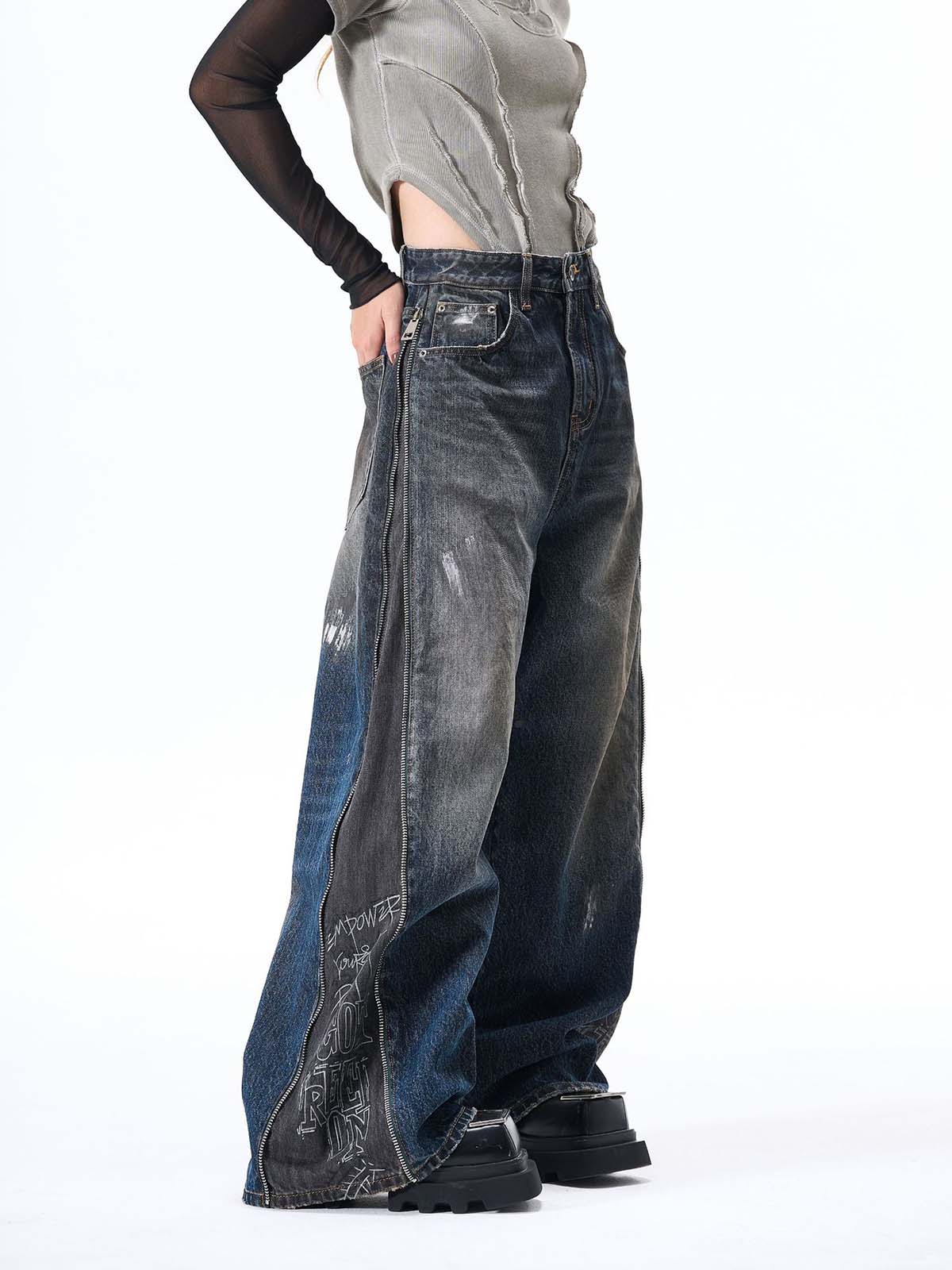 Wide-Leg Denim Jeans with Unique Zipper Design and Graffiti Artwork 
