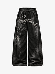 Pantalon de survêtement délavé à jambes larges, avec imprimé graphique scorpion et effet pulvérisé