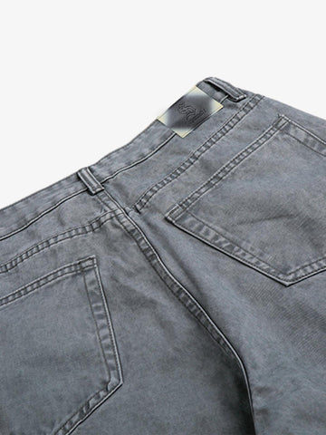 Jeans à rivets découpés