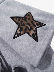 Completo due pezzi con stampa leopardata a righe