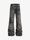 Pantaloni svasati strappati e lavati a strati