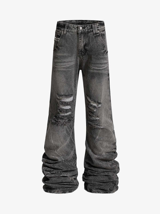 Pantaloni svasati strappati e lavati a strati