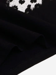 Maglietta a maniche lunghe con stampa leopardata e scritta grafica a patchwork.