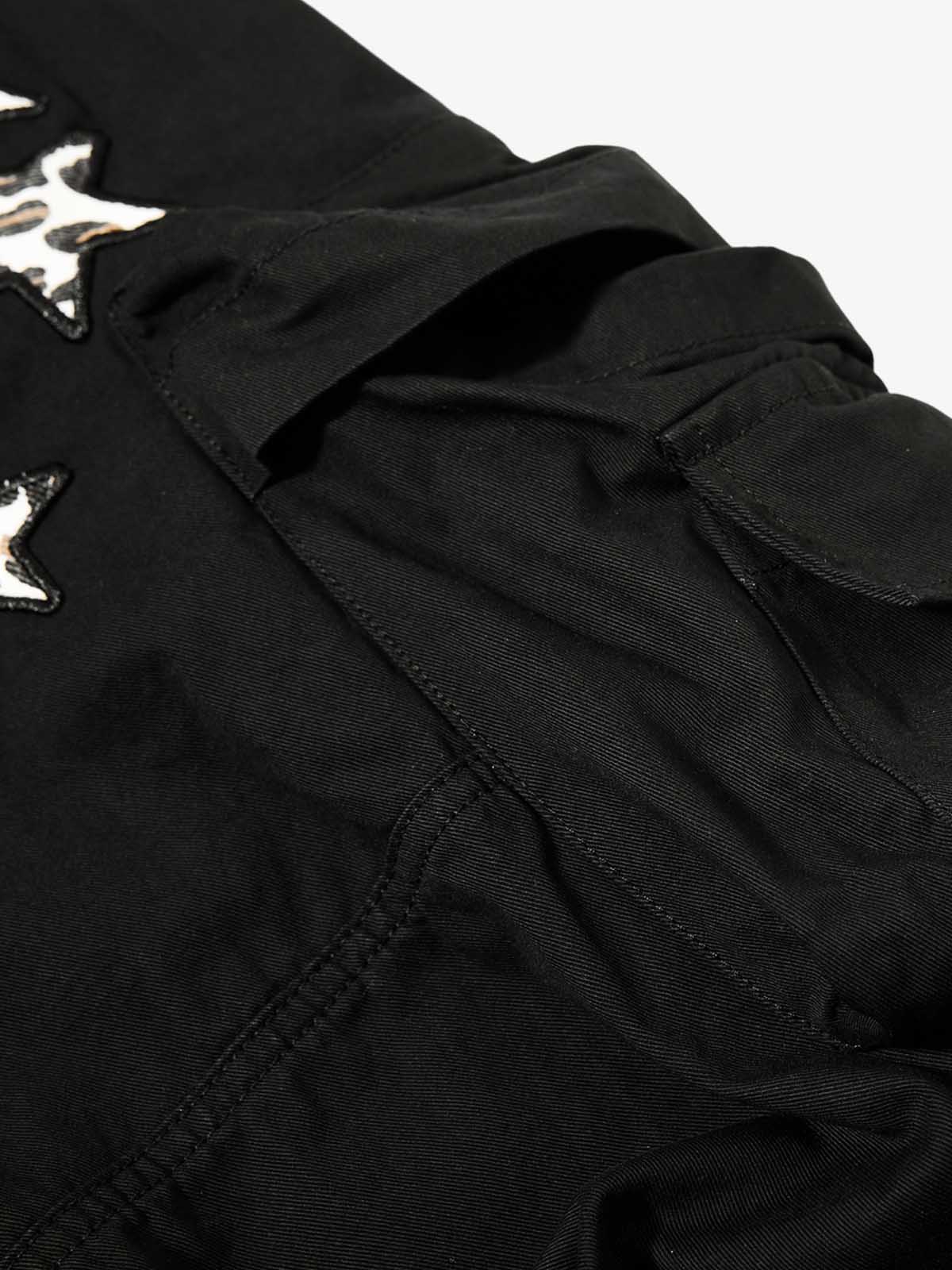 Pantalon brodé étoiles et léopard