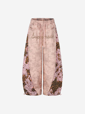 Pantalon de survêtement patchwork léopard avec logo strass