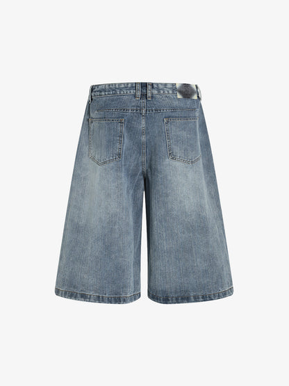 Short en jean délavé à fleurs