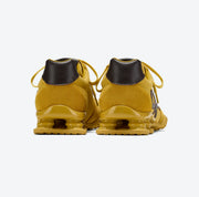 Sneakers in pelle scamosciata con ammortizzazione a molla