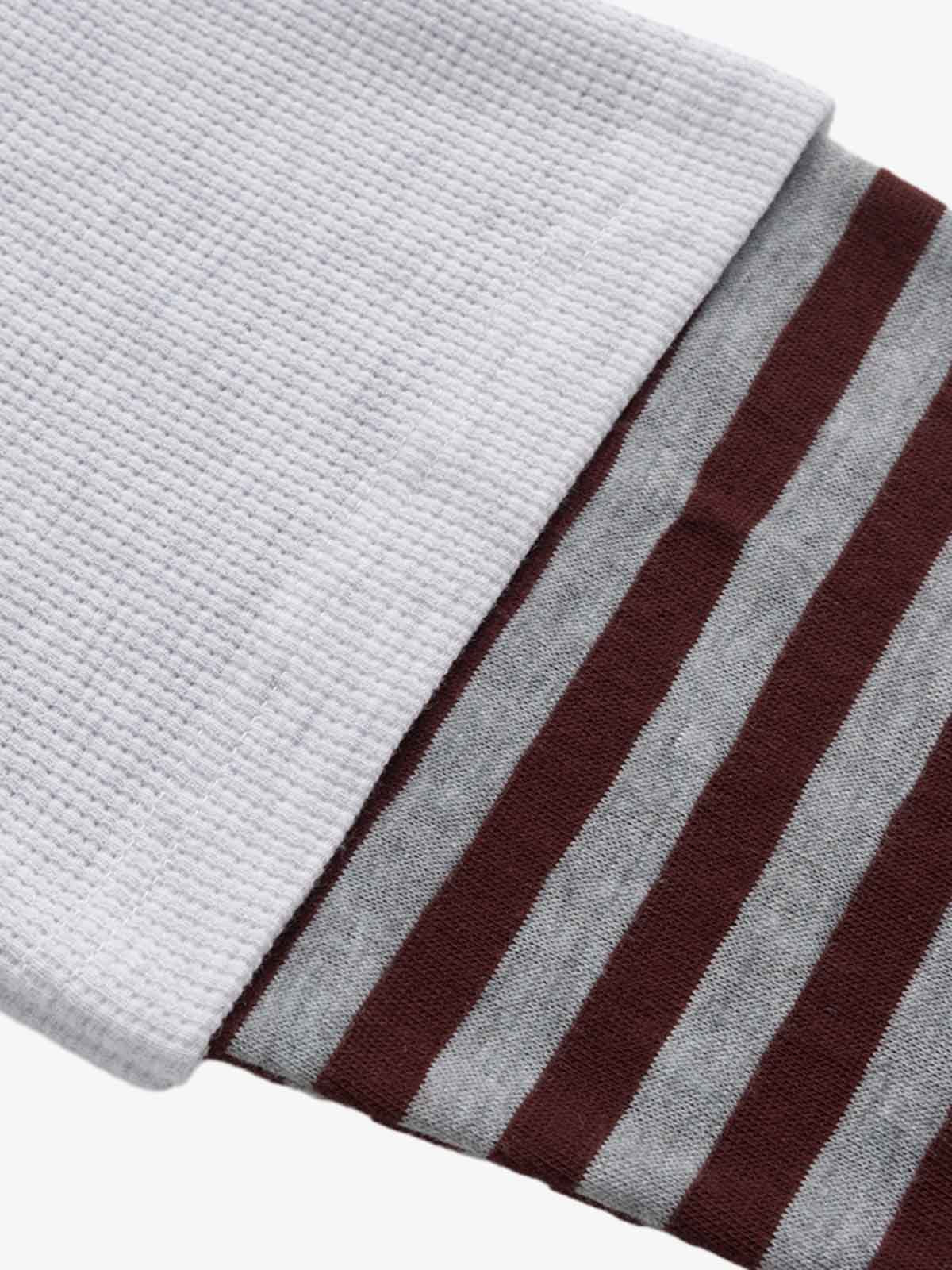 Stylish Black Polo Shirt with Striped Sleeves and Graphic Design 