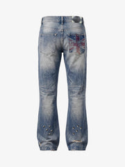 Pantalones vaqueros de bota con bandera y tachuelas
