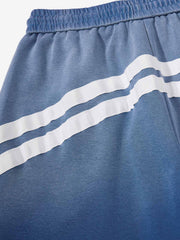 Baggy-Sweatpants mit Used-Look-Muster und geschwungenen Streifen