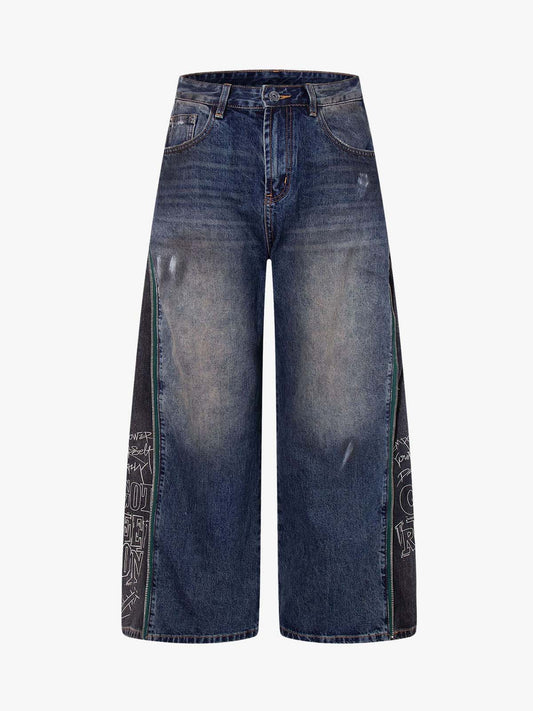 Wide-Leg Denim Jeans with Unique Zipper Design and Graffiti Artwork 