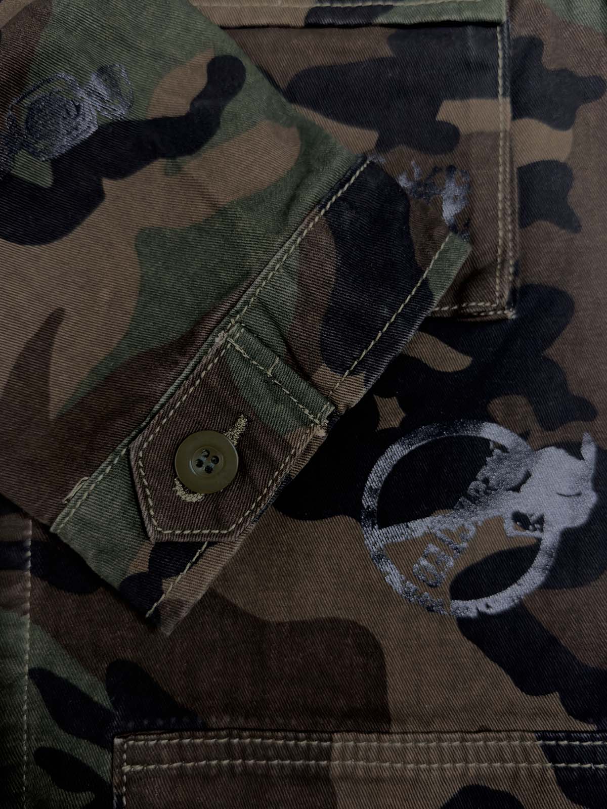 Anti-War Graphic Camo Jacket; Army Green Camouflage / S, Army Green Camouflage / M, Army Green Camouflage / L, Army Green Camouflage / XL, Army Green Camouflage / 2XL