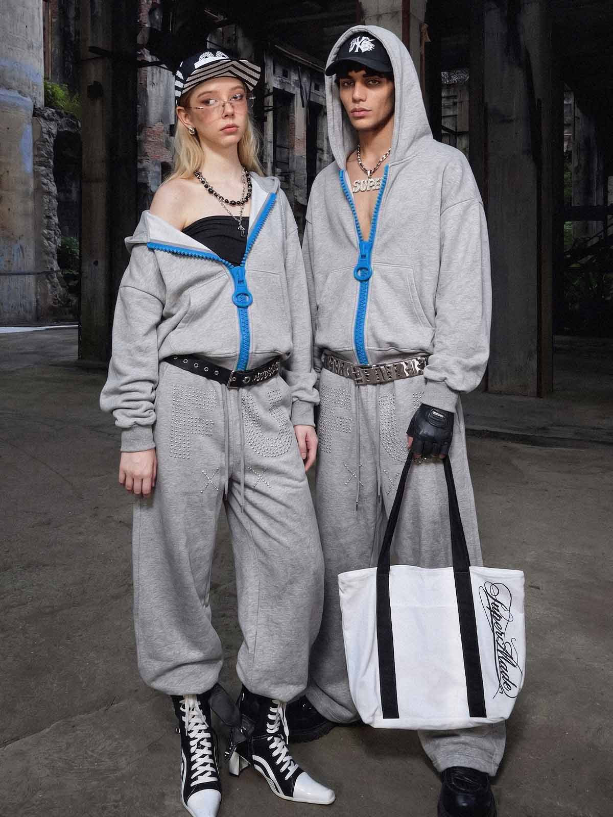 Supermade gray zip hoodies styled open with loose gray pants
