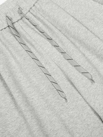 Checkered Wide-Leg Pants with Asymmetric Zippered Panel 