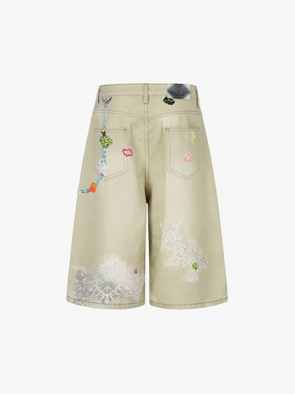 Jeansshorts mit Blumenapplikationen im Used-Look