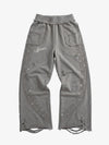 Pantalones asimétricos con logo bordado