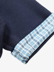 Poloshirt aus Piqué-Baumwolle mit kariertem Kontrastkragen und -bündchen
