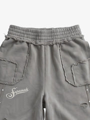Asymmetrical Logo Embroidered Pants