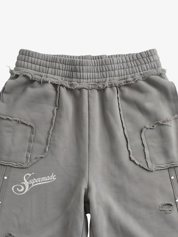 Asymmetrical Logo Embroidered Pants