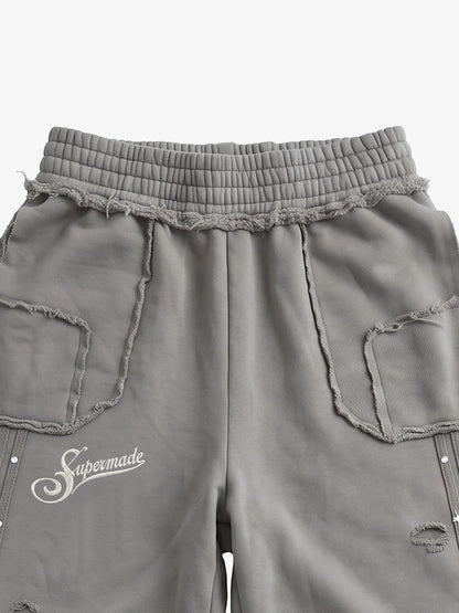 Asymmetrical Logo Embroidered Pants