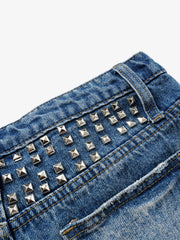 Mini shorts a vita bassa con borchie metalliche effetto invecchiato di Thesupermade