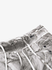 Pantalones anchos desgastados