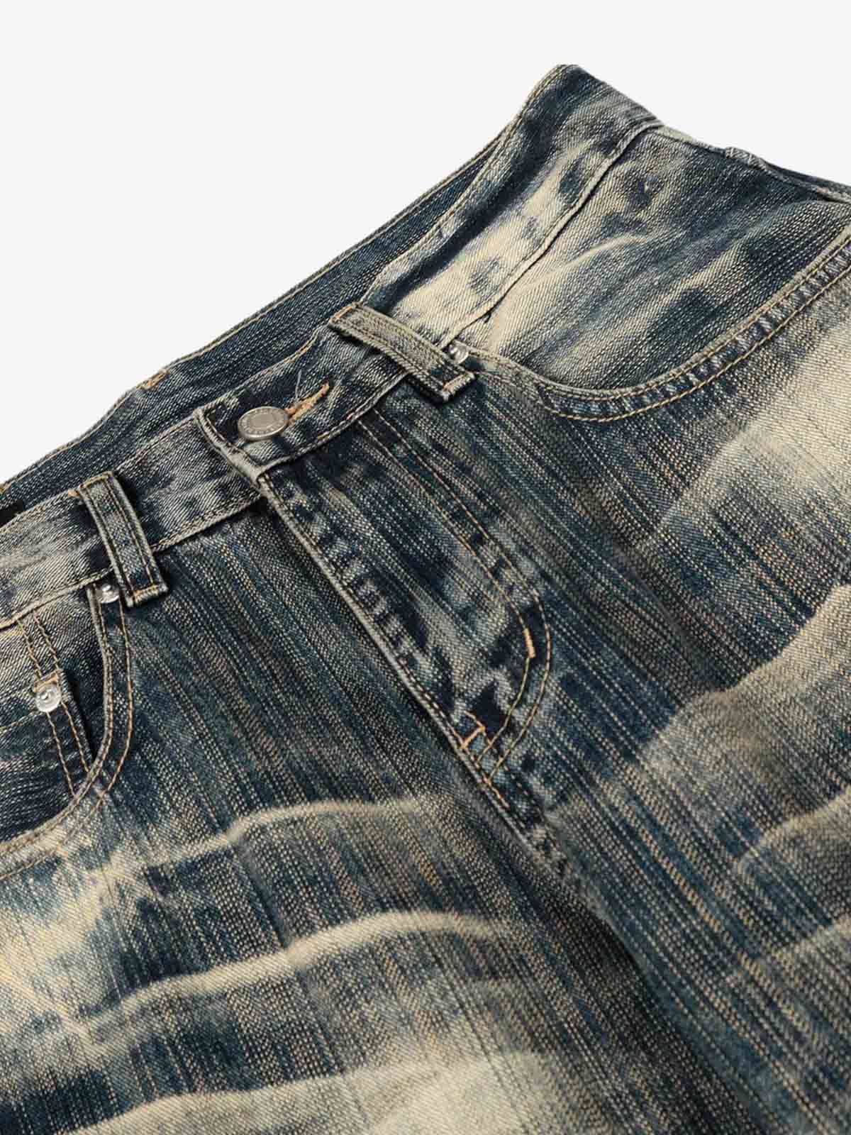 Dirty Wash Distressed Curved Blade Denim Jeans