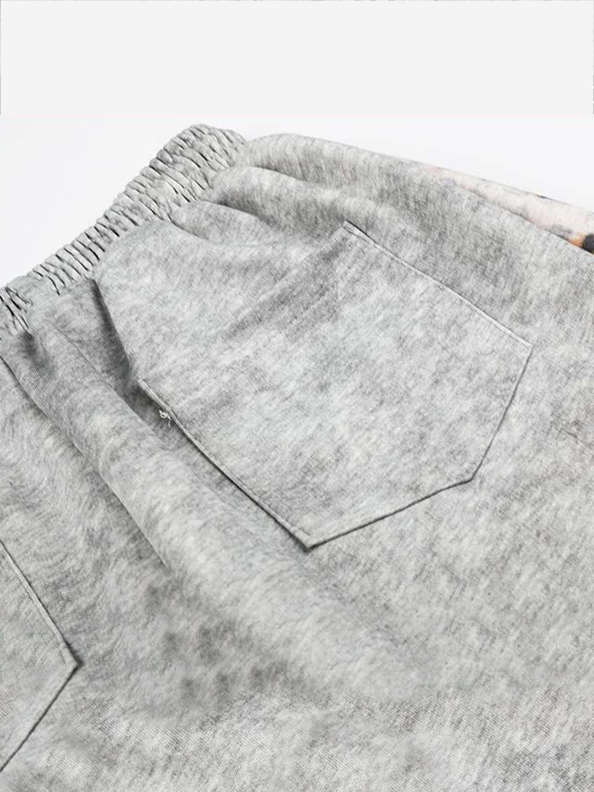 Pantalon de survêtement patchwork léopard avec logo strass