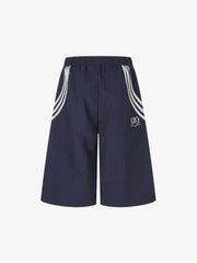 Shorts mit diagonalem Patchwork-Muster und Kordelzug