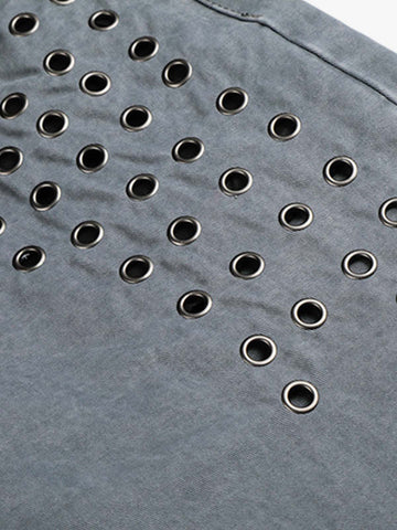 Jeans à rivets découpés