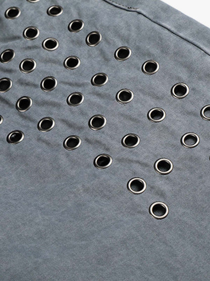 Jeans à rivets découpés