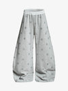Pantaloni con stampa a stelle e cintura a blocchi di colore