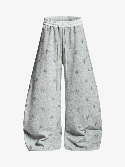 Pantaloni con stampa a stelle e cintura a blocchi di colore