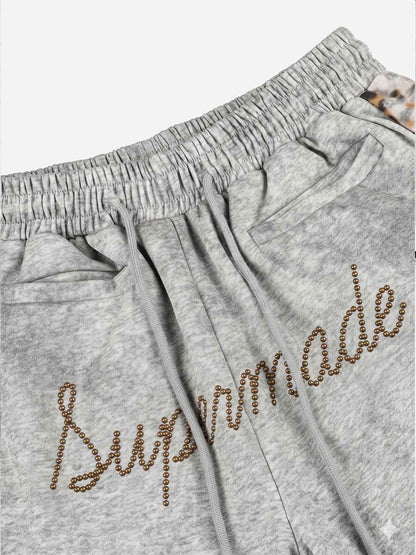 Pantalon de survêtement patchwork léopard avec logo strass