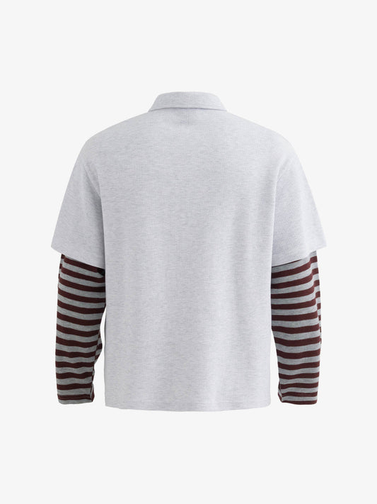 Stylish Black Polo Shirt with Striped Sleeves and Graphic Design 