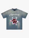 T-shirt à imprimé floral et étoiles délavé