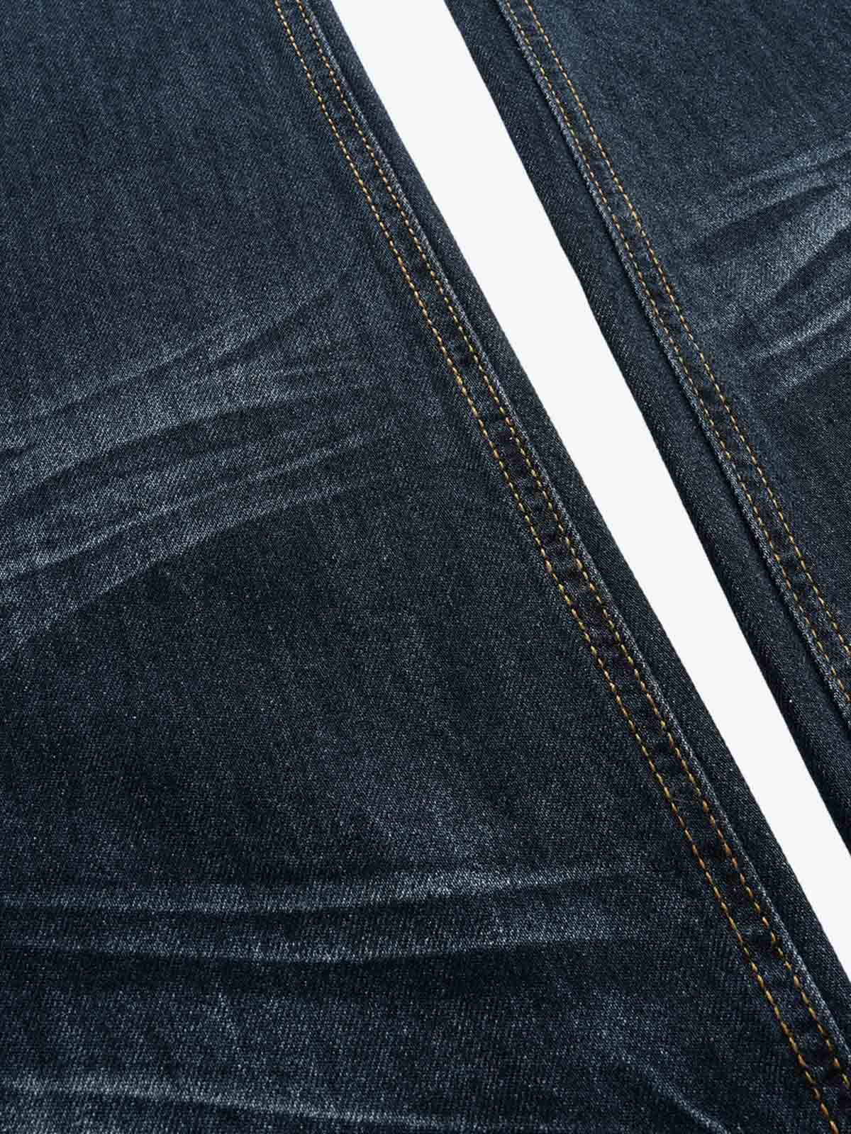 Jeans de corte bota de tiro bajo con tachuelas metálicas de Thesupermade