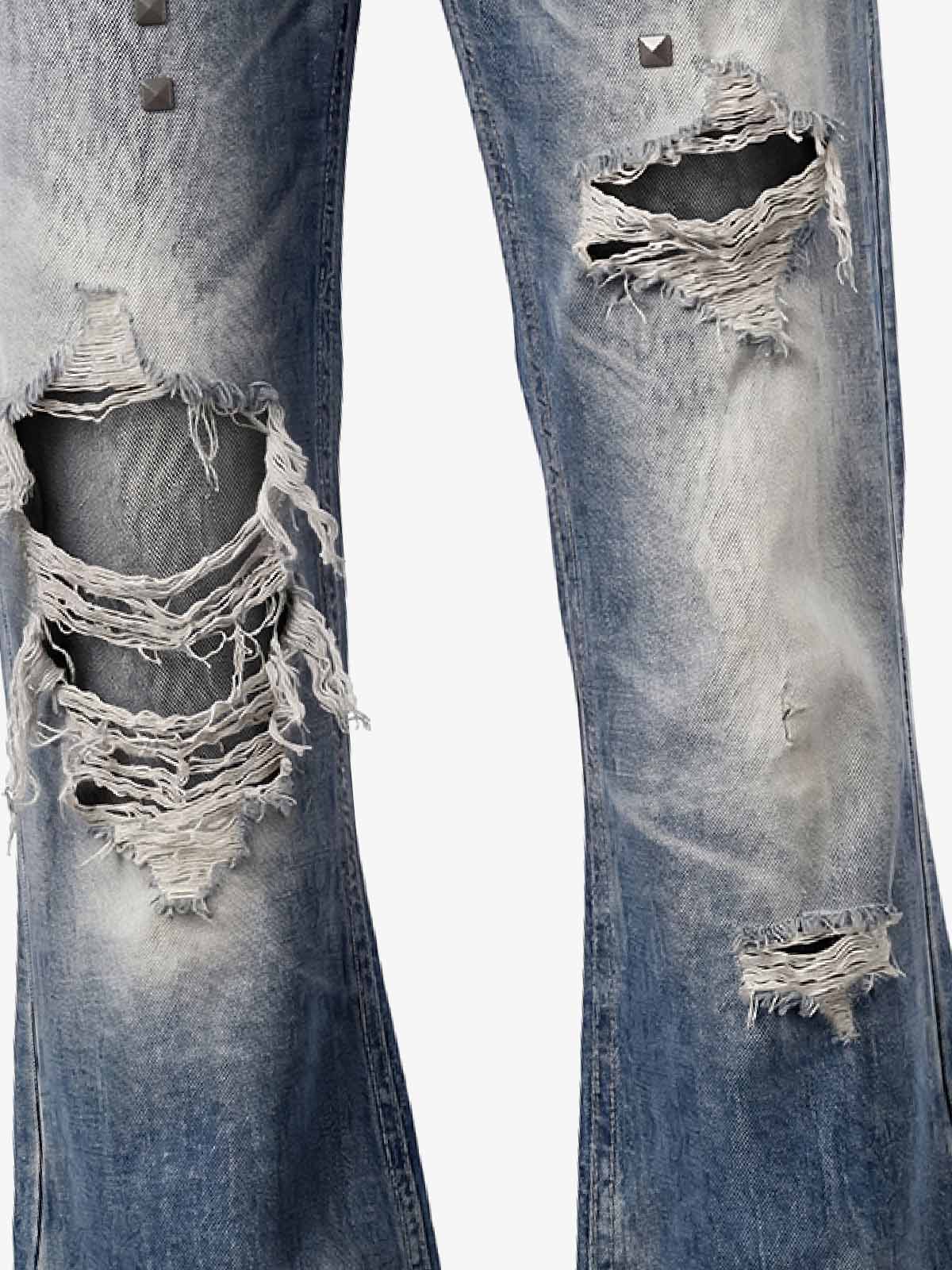 Pantalones vaqueros de bota con bandera y tachuelas