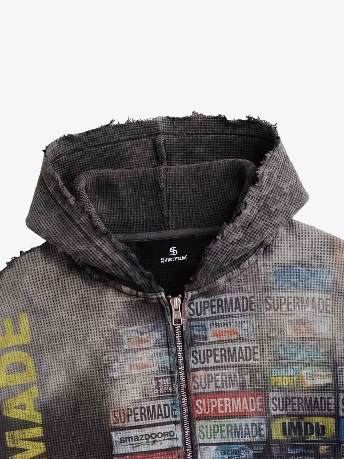 Printed label motifs on dark waffle-knit hoodie fabric