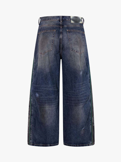 Wide-Leg Denim Jeans with Unique Zipper Design and Graffiti Artwork 