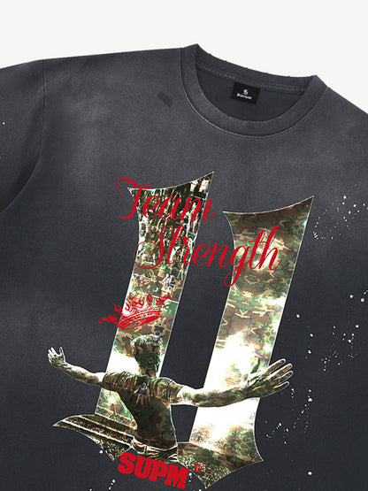 Unisex distressed loose-fitting cotton short-sleeved T-shirts featuring a print of the "11" team strength from the FIFA World Cup and a splatter-wash finish. 