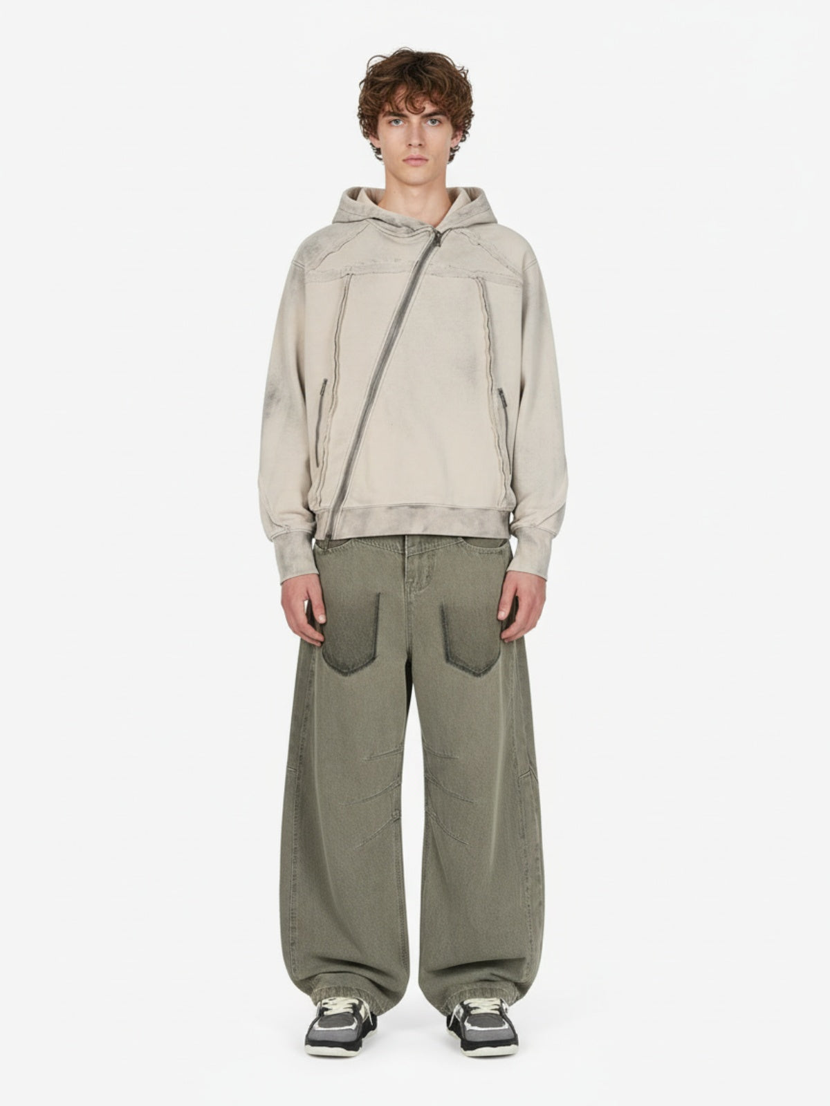 Apricot hoodie worn with olive trousers and sneakers