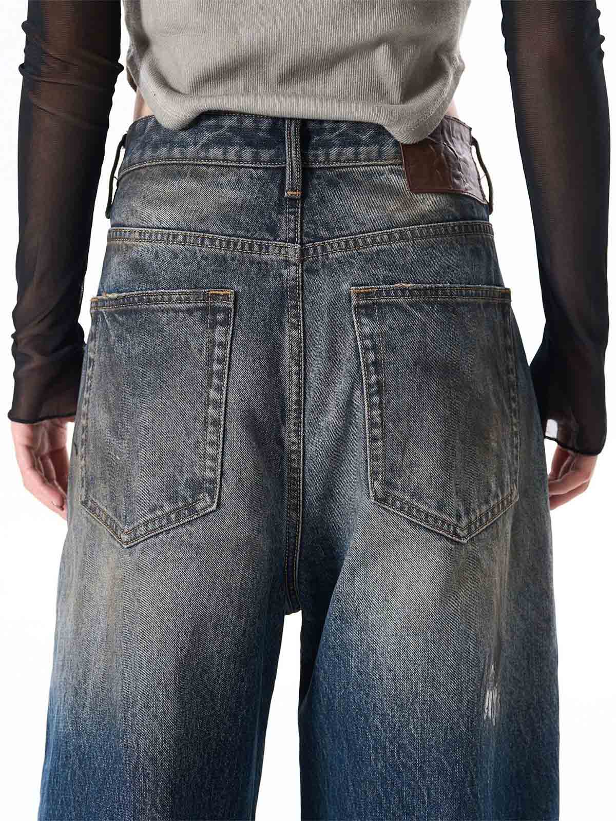 Wide-Leg Denim Jeans with Unique Zipper Design and Graffiti Artwork 