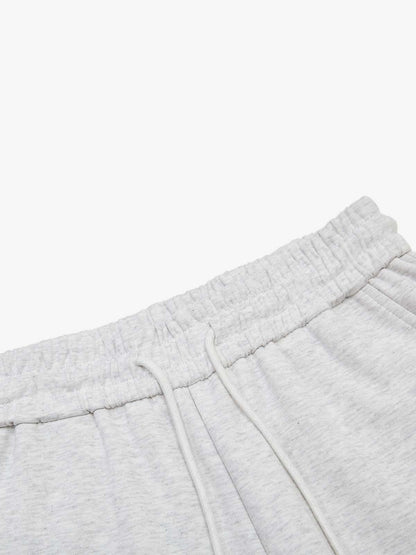Pantalon de survêtement à jambes larges avec typographie multicolore