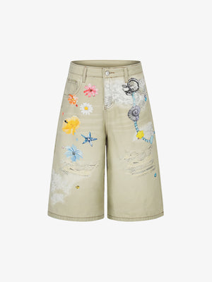 Jeansshorts mit Blumenapplikationen im Used-Look