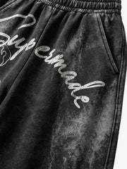 Pantalon de survêtement délavé à jambes larges, avec imprimé graphique scorpion et effet pulvérisé